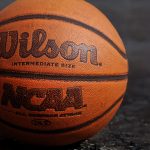 Wilson NCAA basketball on black board